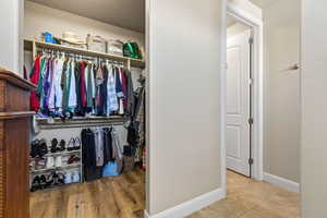 Spacious closet featuring light tile patterned floors