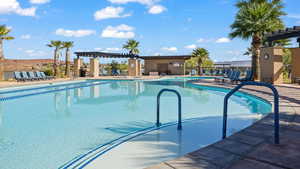 View of pool featuring a pergola and a patio area