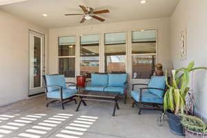 View of patio / terrace with ceiling fan and outdoor lounge area