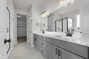 Bathroom featuring vanity and walk in shower