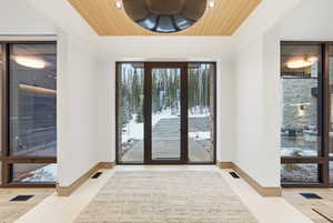 Doorway to property featuring french doors
