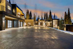 View of front of house featuring a balcony and driveway