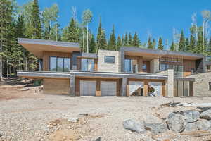 Modern home featuring stone siding