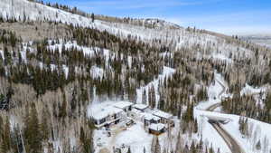 Snowy aerial view featuring a mountain view