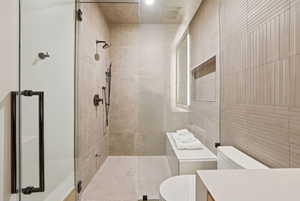 Full bathroom with walk in shower and vanity