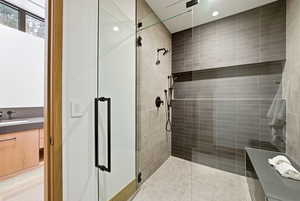 Bathroom with a shower stall and a sink