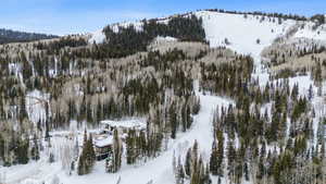 Snowy aerial view featuring a mountain view