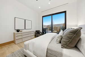 Bedroom with access to outside, wood finished floors, ceiling fan, and recessed lighting