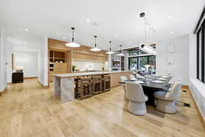 Dining room featuring recessed lighting and light wood-type flooring