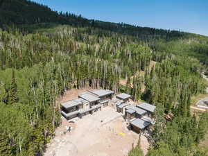 View of subject property featuring a forest