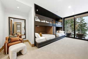 Bedroom featuring light carpet, recessed lighting, access to exterior, and floor to ceiling windows