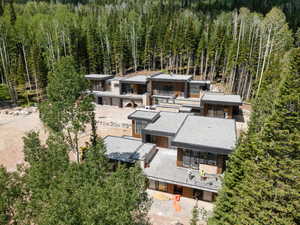 View from above of property featuring a forest