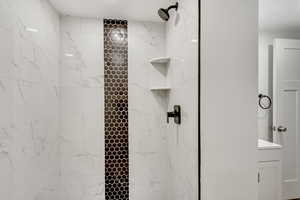 Bathroom with tiled shower