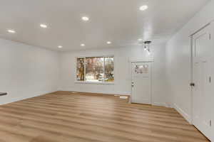 Entrance foyer featuring light hardwood / wood-style floors