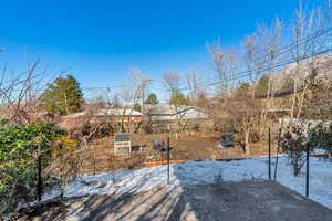 View of yard covered in snow