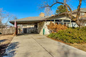 View of side of home featuring a carport