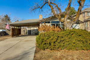 View of property exterior featuring a carport