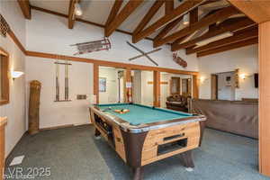 Recreation room featuring high vaulted ceiling, billiards, beamed ceiling, and dark colored carpet