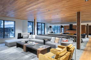 Living room featuring wooden ceiling and light wood-type flooring