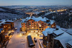 Snowy aerial view featuring a mountain view