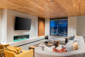 Living room featuring wood ceiling