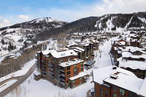 Snowy aerial view with a mountain view