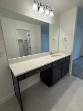 Bathroom featuring vanity and tile patterned flooring