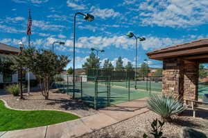 View of tennis court with fence