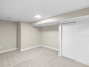 Basement with light carpet