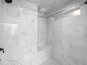Bathroom with tiled shower