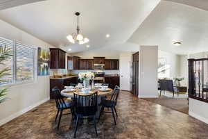 Dining area with vaulted ceiling and a wealth of natural light