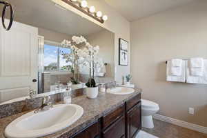 Master bathroom featuring double sinks