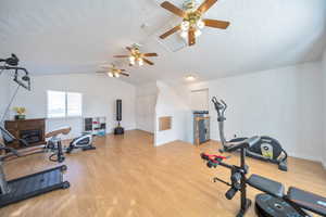 Family room or workout room with vaulted ceiling