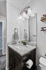 Bathroom with vanity and toilet