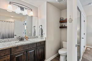 Bathroom with vanity and toilet