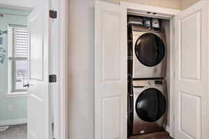 Laundry area featuring stacked washer / dryer