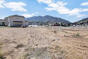 View of mountain backdrop featuring nearby suburban area