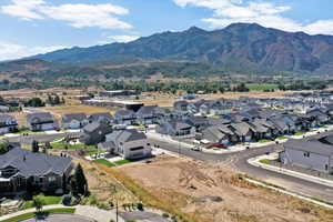 Aerial perspective of suburban area with a mountain backdrop