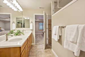 Bathroom with vanity and tile patterned floors