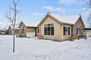 View of snowy exterior with central AC