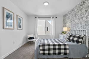 Bedroom with carpet and a textured ceiling