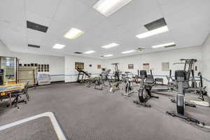 Gym with a paneled ceiling