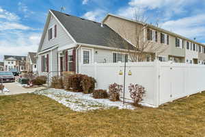 View of property exterior with a yard