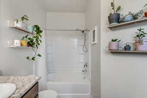 Full ensuite bathroom featuring shower / bathtub combination