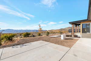 Exterior space featuring a mountain view and a patio area