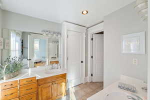 Bathroom featuring vanity and tile patterned flooring