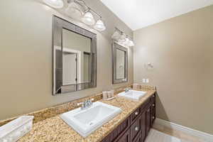 Bathroom featuring vanity and tile patterned flooring