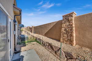 View of yard featuring central AC unit and a patio area