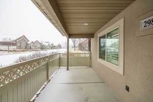 View of snow covered front of property