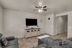 Living room featuring ceiling fan